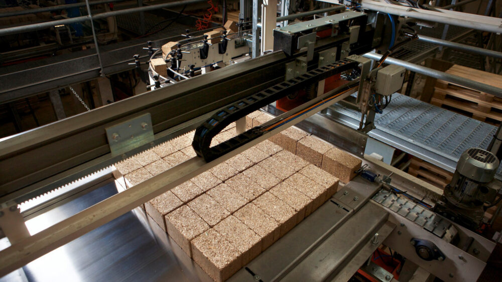 A layer of composite pallet blocks being gathered on the stacking station of the Eirebloc production line.