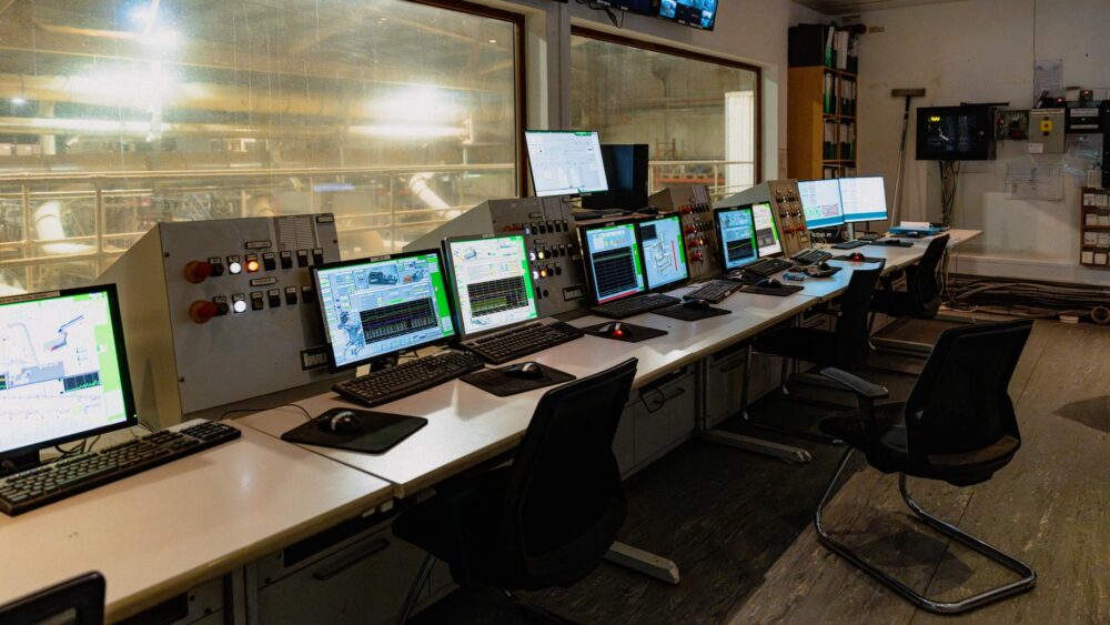 The Eirebloc control room, with a row of monitors showing the automated production line.