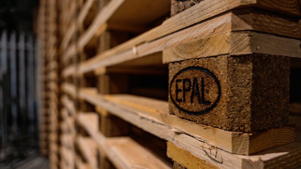 A finished pallet built with composite blocks, one stamped with the EPAL mark.